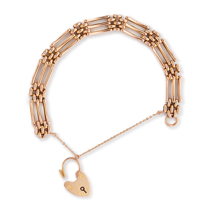 Stylish Victorian 9ct rose gold gateleg bracelet with a padlock and safety chain. Fine engraving on one side.