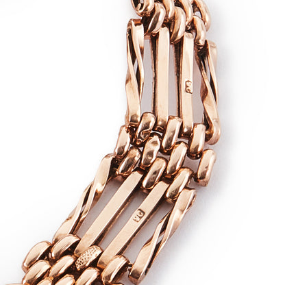 Stylish Victorian 9ct rose gold gateleg bracelet with some lightly textured links and a padlock. Safety chain attached.