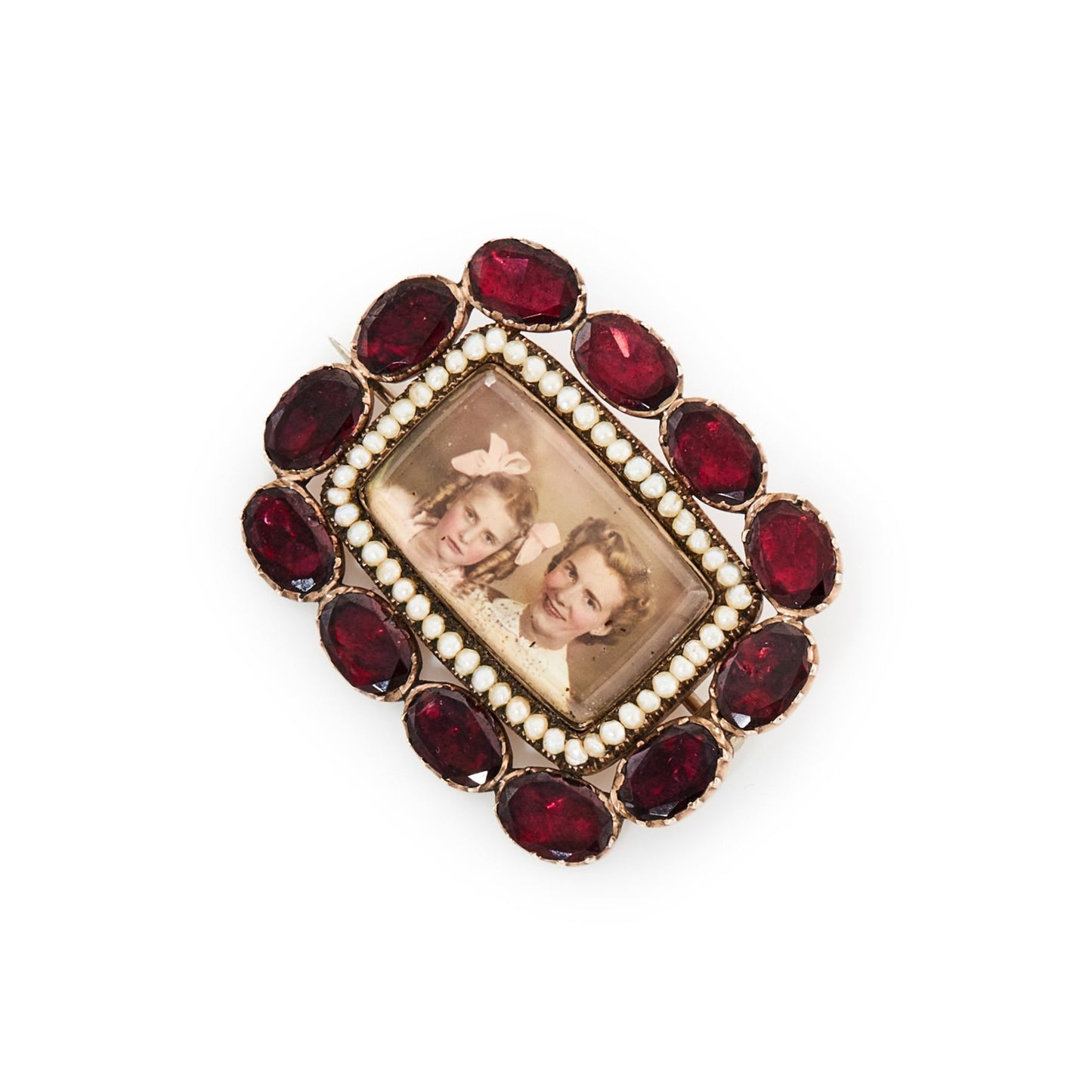 Very unusual Victorian 9ct gold memento mori picture brooch depicting a mother and daughter, surrounded by fine seed pearls and twelve oval shaped deep red old cut garnets.