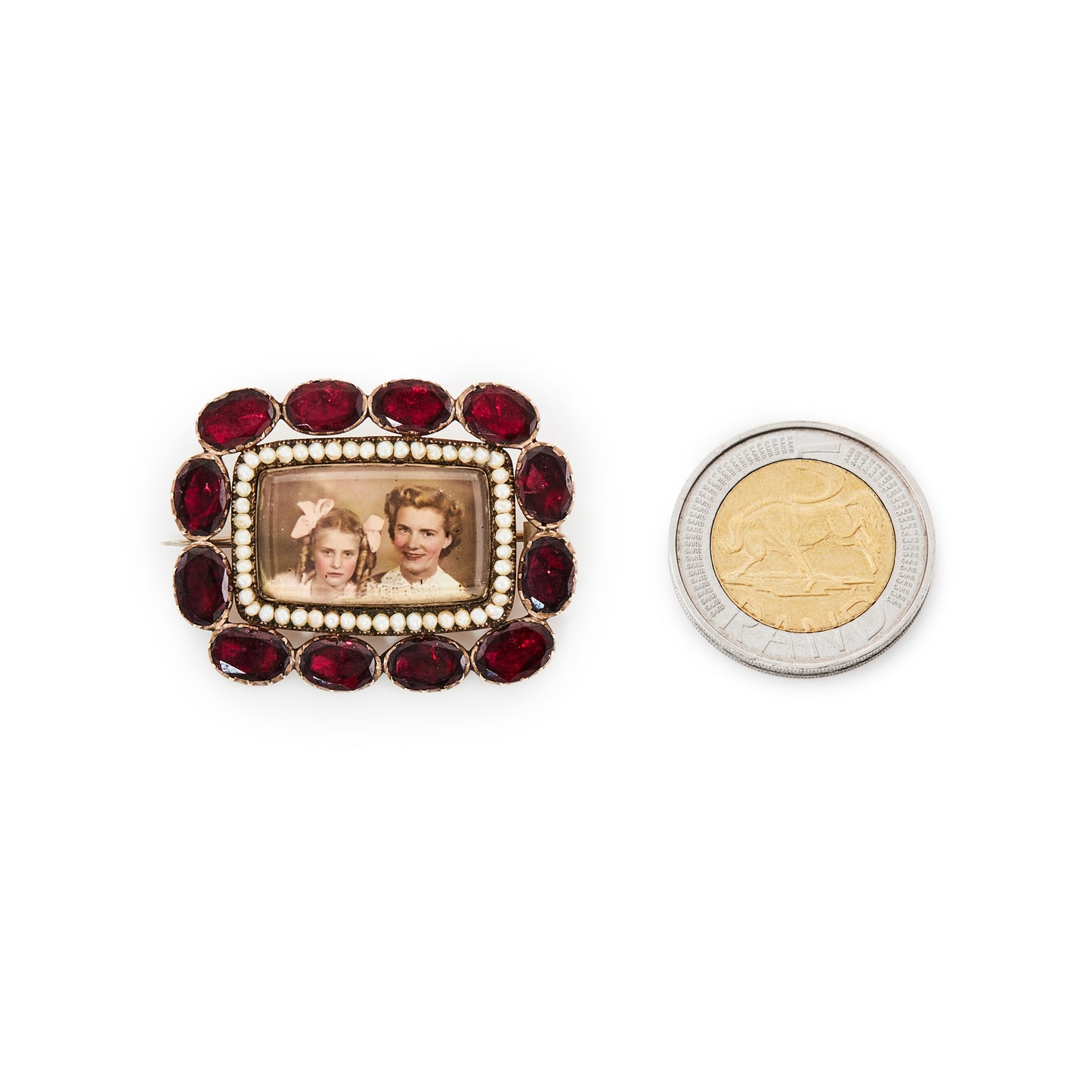 Very unusual Victorian 9ct gold memento mori picture brooch depicting a mother and daughter, surrounded by fine seed pearls and twelve oval shaped deep red old cut garnets.