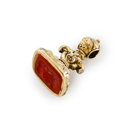 Charming Victorian gold cased seal set with a carnelian intaglio depicting the face of a warrior.