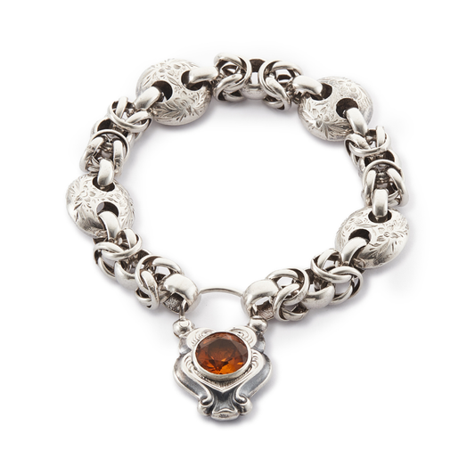 Stunning Scottish silver Victorian fancy link bracelet with a beautiful padlock set with a Cairngorm gemstone. The large links and padlock feature lovely floral engraving.