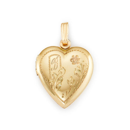 Quaint vintage 12ct gold on sterling silver heart locked with beautiful floral engraving and the initial B. The locket holds two photographs.