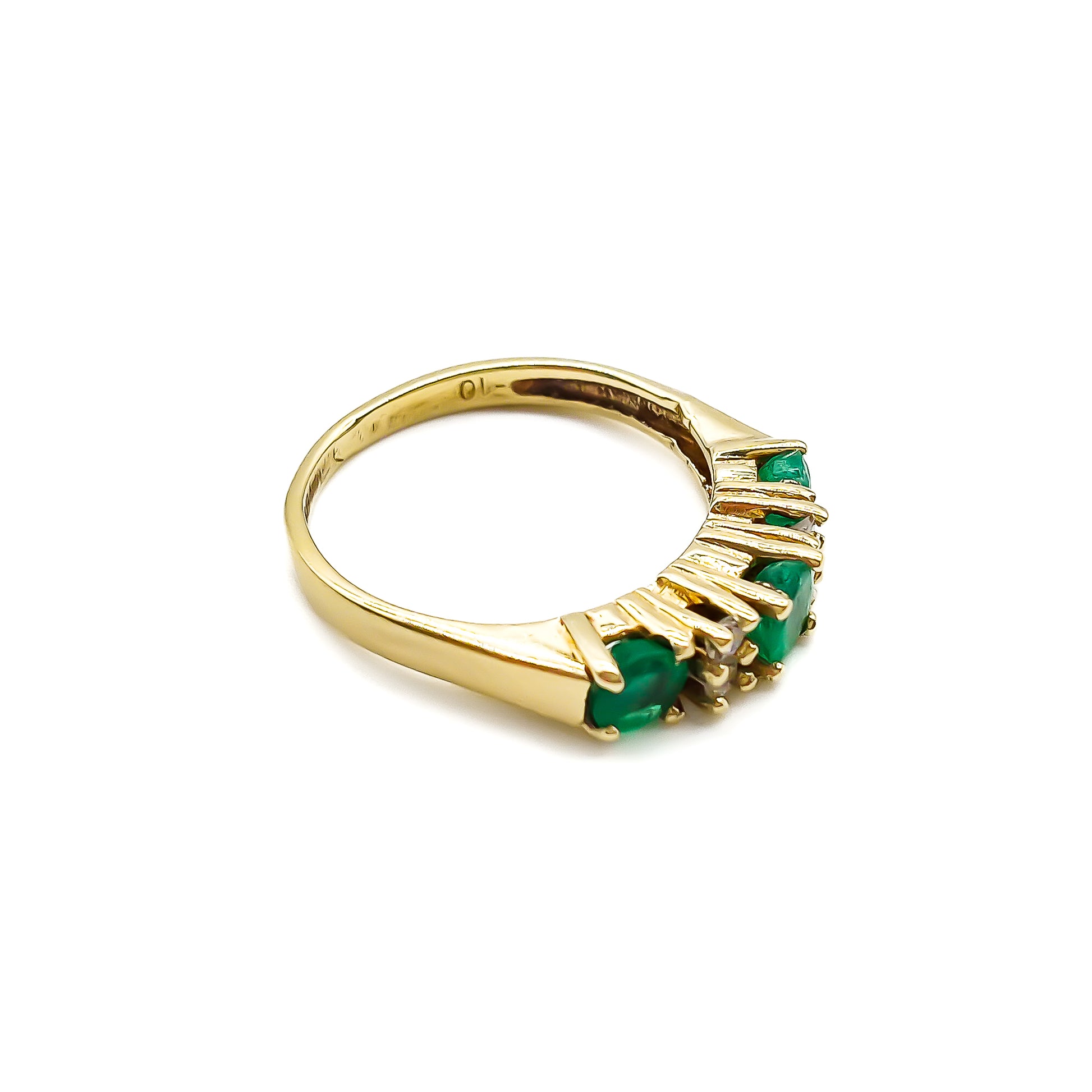 Classic vintage 14ct yellow gold ring set with three round emeralds and four small diamonds.