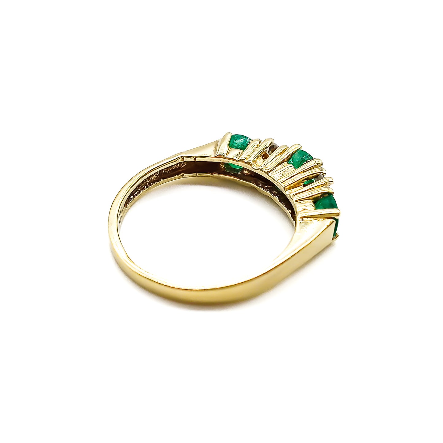 Classic vintage 14ct yellow gold ring set with three round emeralds and four small diamonds.