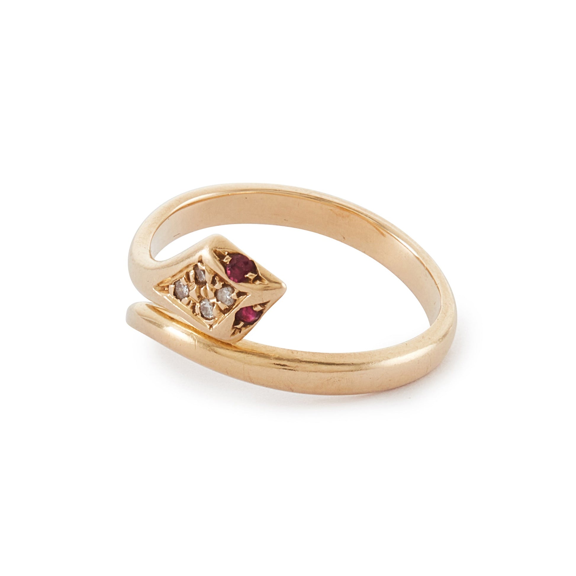 Gorgeous vintage 18ct gold serpent ring set with four diamonds in the head and ruby eyes. The ring is open, so the ring size is easily adjustable. Italy