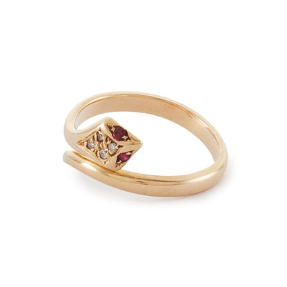 Gorgeous vintage 18ct gold serpent ring set with four diamonds in the head and ruby eyes. The ring is open, so the ring size is easily adjustable. Italy