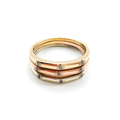 Elegant vintage 18ct yellow, white and rose gold ring set with nine small diamonds.