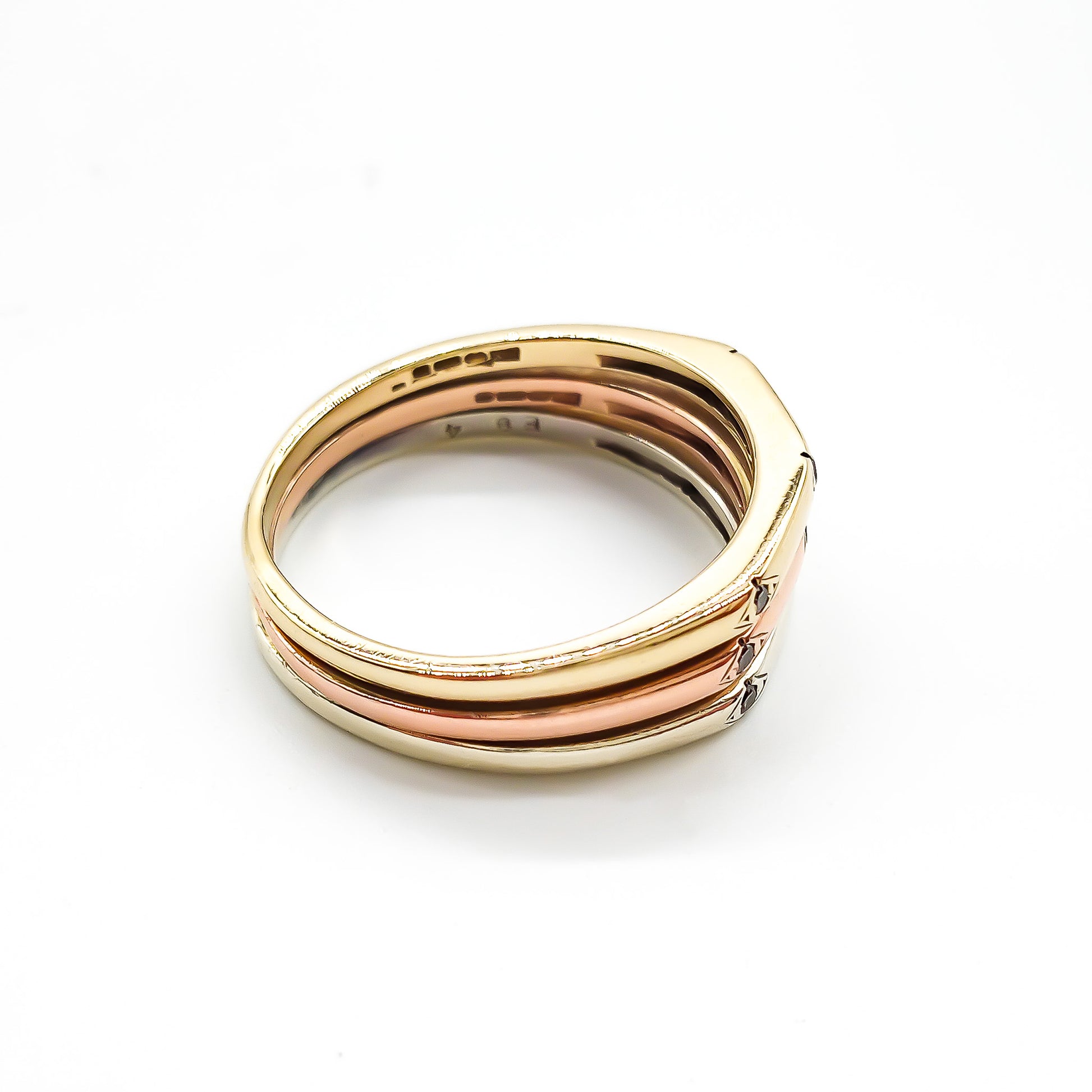 Elegant vintage 18ct yellow, white and rose gold ring set with nine small diamonds.