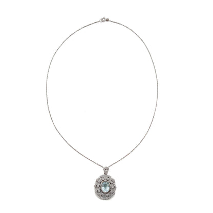 Gorgeous vintage 18ct white gold pendant set with pavé set diamonds and a beautifully faceted oval aquamarine, on an 18ct white gold chain.