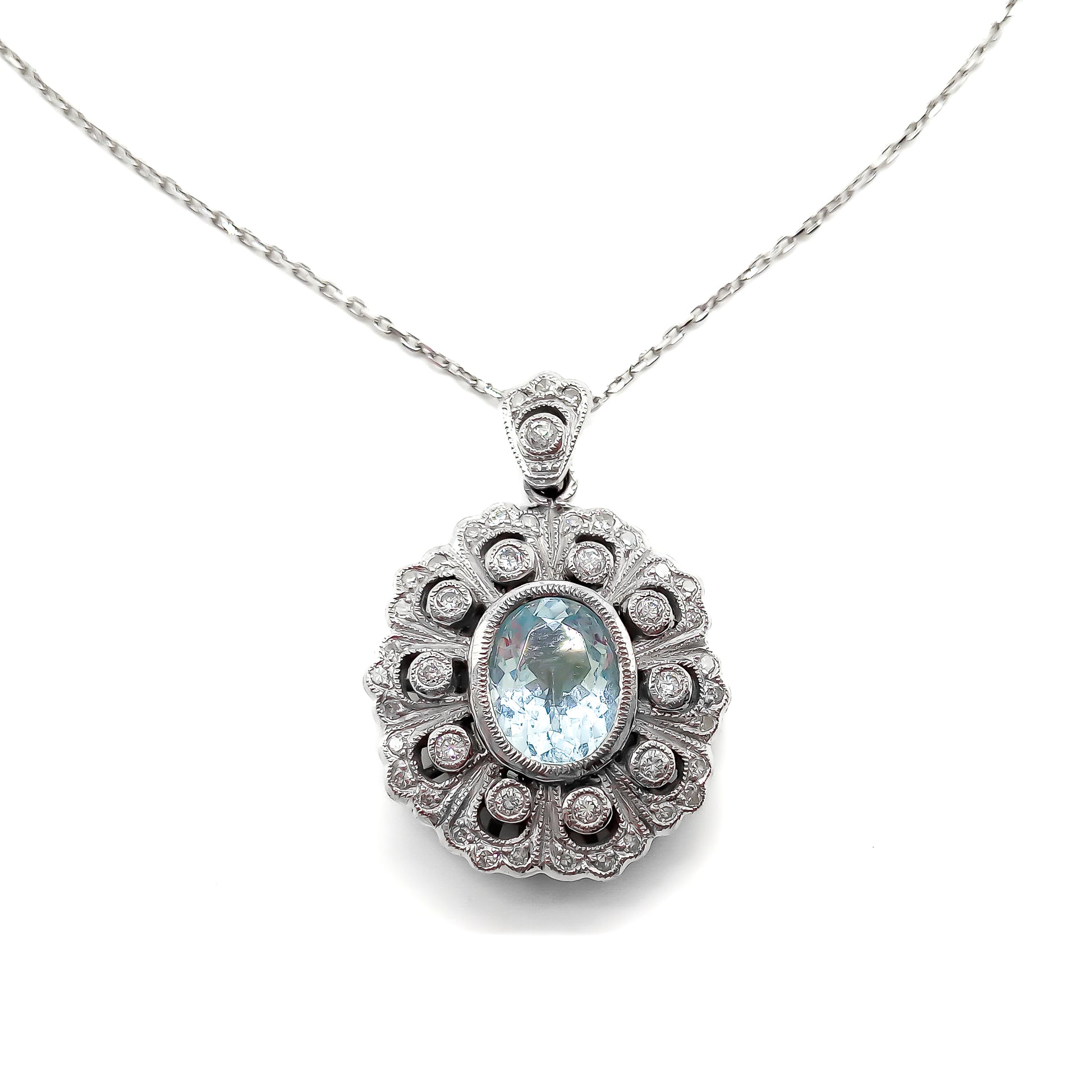 Gorgeous vintage 18ct white gold pendant set with pavé set diamonds and a beautifully faceted oval aquamarine, on an 18ct white gold chain.