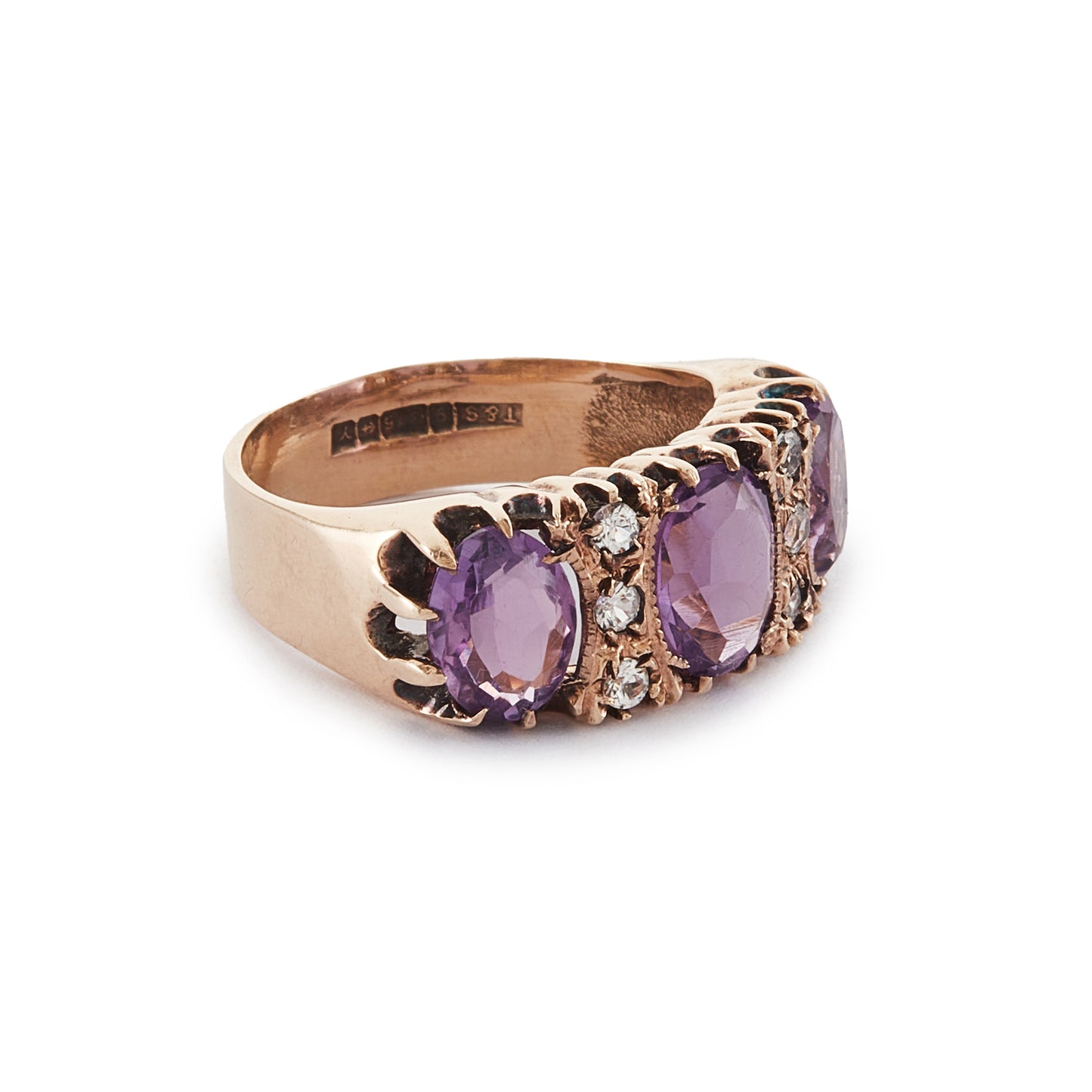 9ct Rose gold trilogy ring set with three beautifully faceted purple amethysts, interspersed with small, white, round-cut spinels.