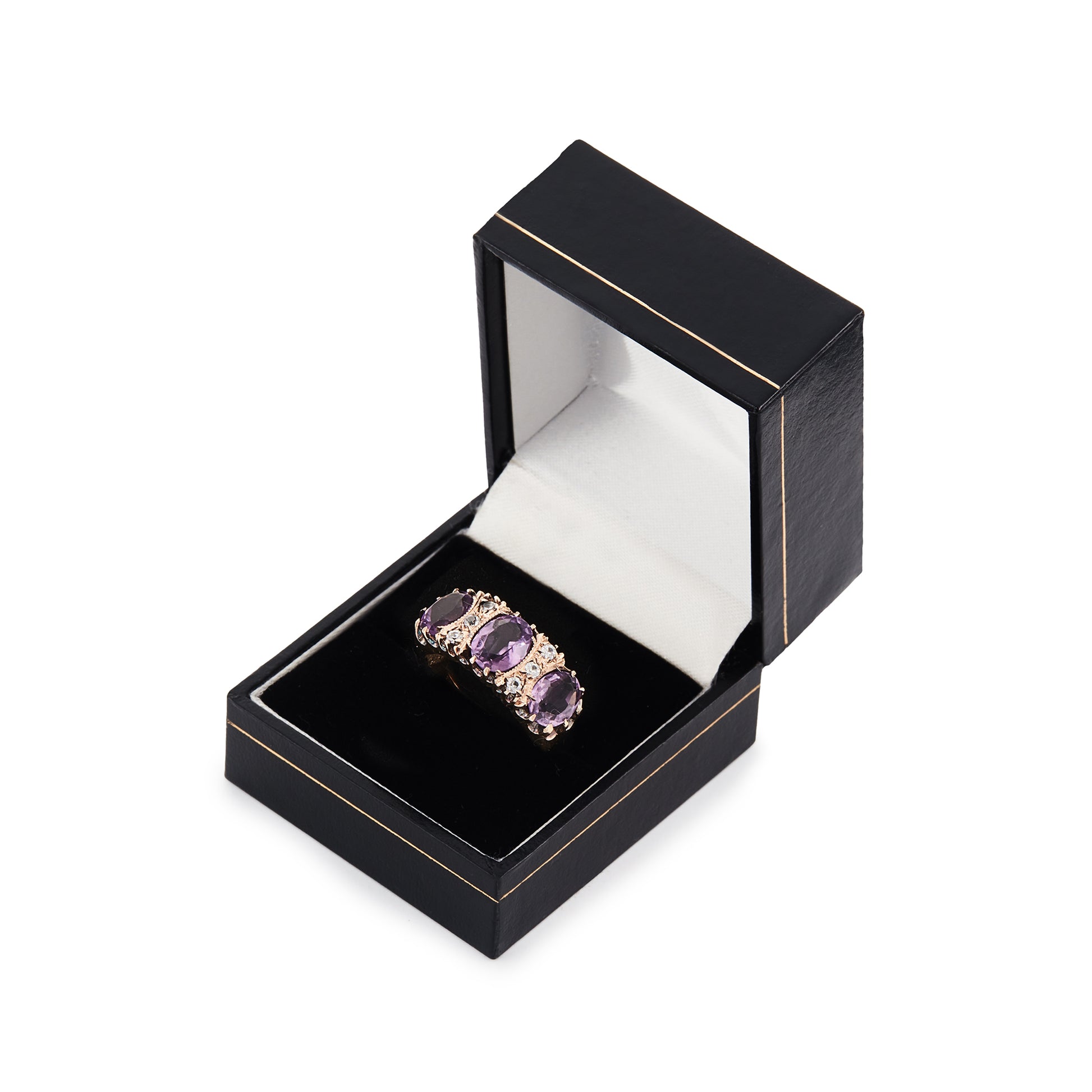 9ct Rose gold trilogy ring set with three beautifully faceted purple amethysts, interspersed with small, white, round-cut spinels.