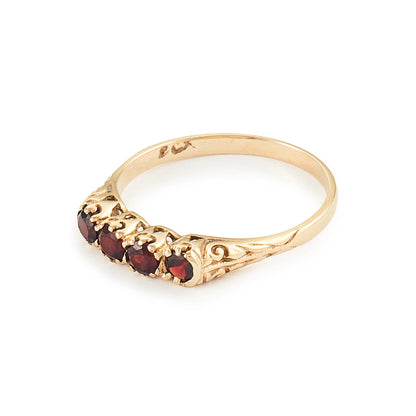 Classic vintage 9ct yellow gold ring set with four deep-red faceted garnets. Size: M