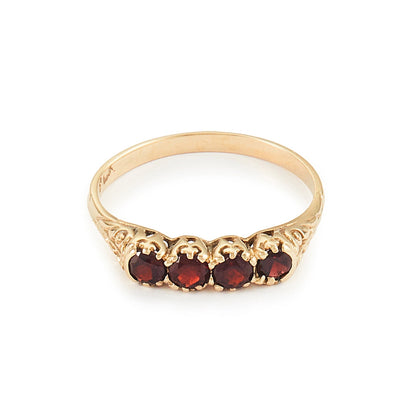 Classic vintage 9ct yellow gold ring set with four deep-red faceted garnets. Size: M