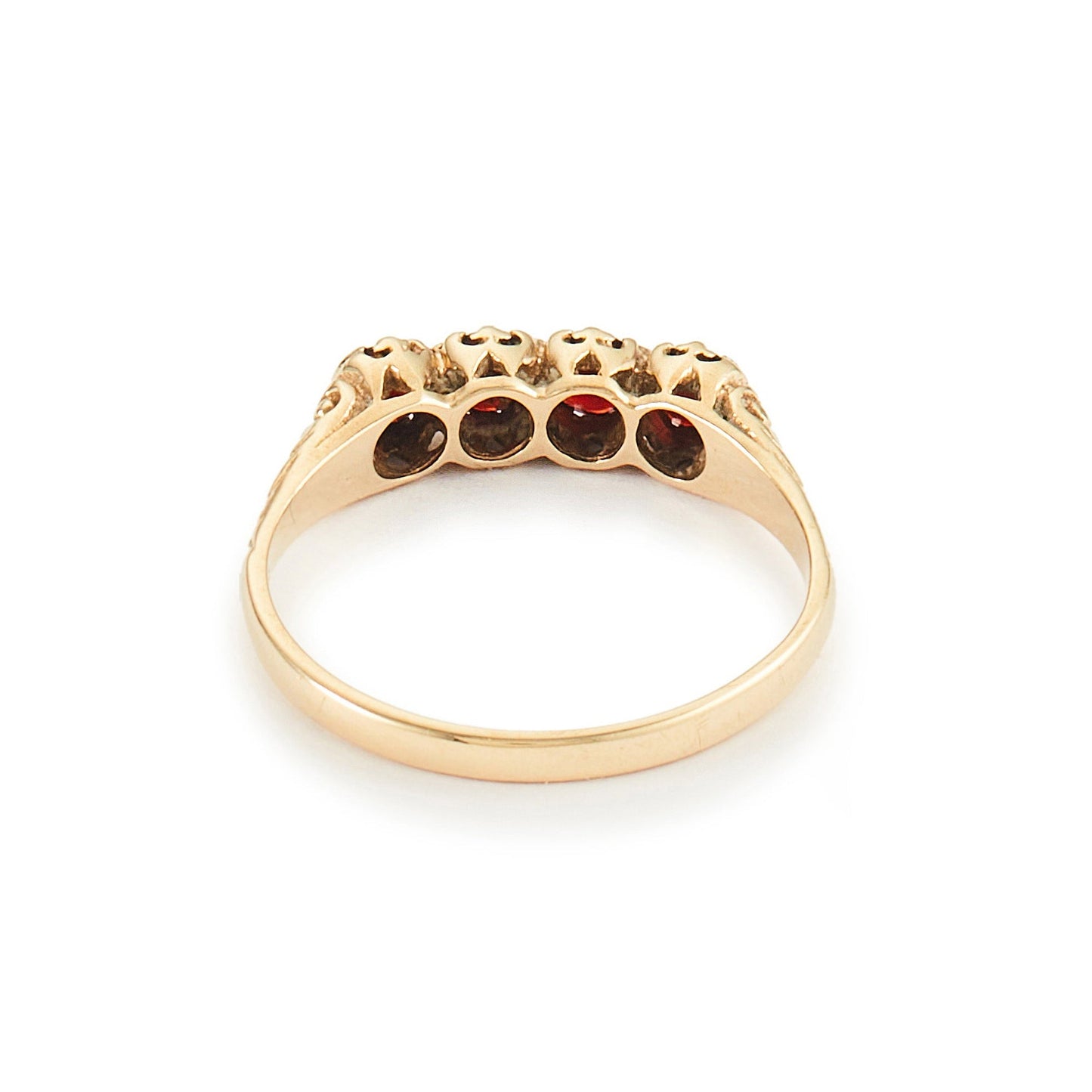 Classic vintage 9ct yellow gold ring set with four deep-red faceted garnets. Size: M