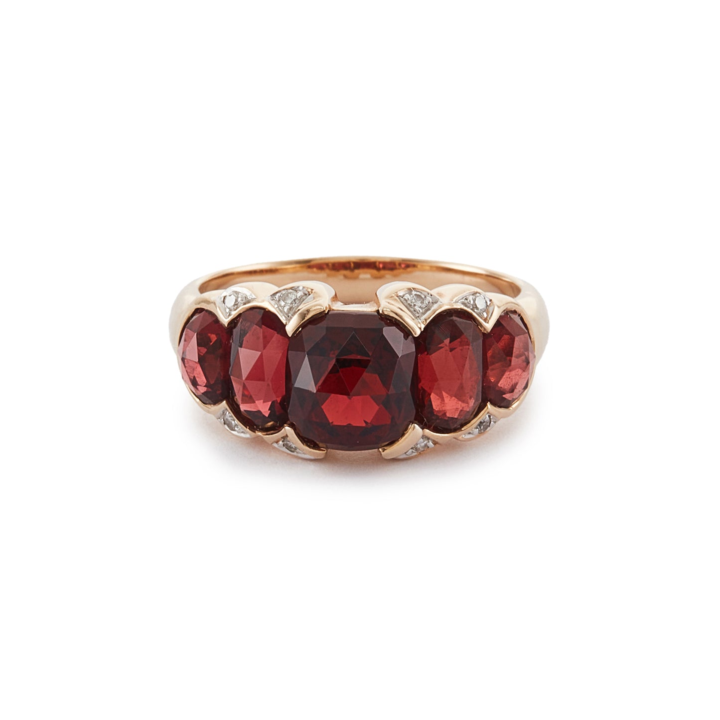 Stunning vintage 9ct gold ring set with five beautifully faceted garnets and eight small diamonds around the stones.
