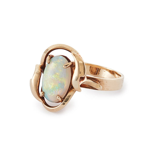 Lovely vintage 9ct gold ring set with a luminous fire opal that exudes vibrant hues of green, blue and orange.