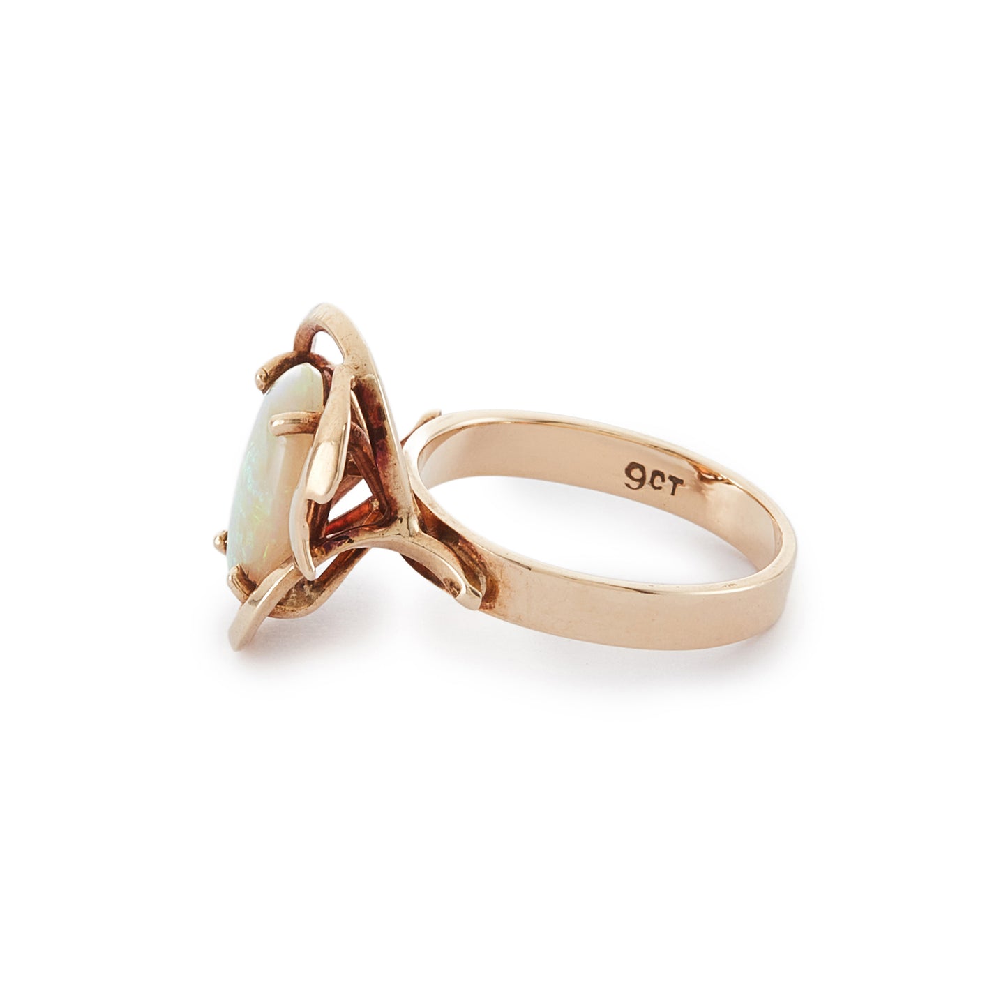 Lovely vintage 9ct gold ring set with a luminous fire opal that exudes vibrant hues of green, blue and orange.