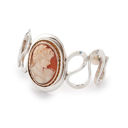 Beautifully handcrafted vintage designer sterling silver bangle with a classic cameo in a 9ct rose gold frame and 9ct rose gold beads at the opening. Will fit most wrists.