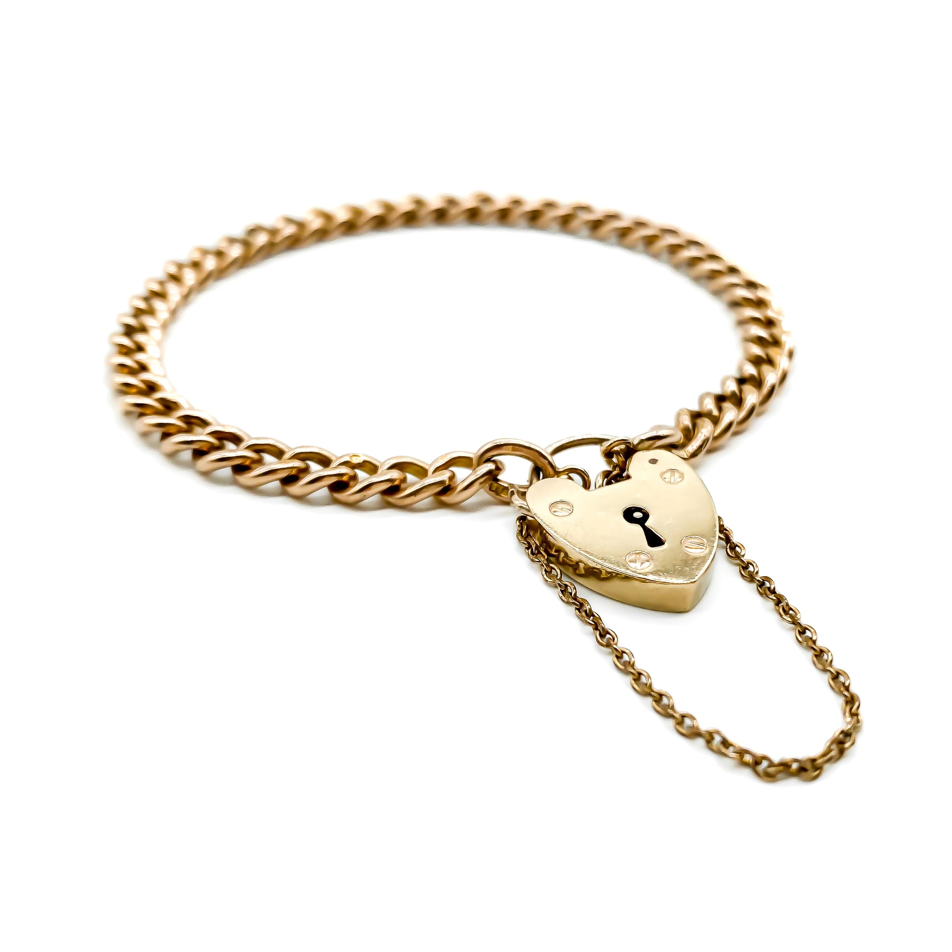 Classic vintage 9ct rose gold curb link bracelet with padlock. Every link is stamped. London 1959