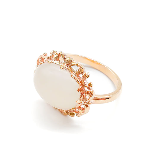 Vintage oval moonstone in a beautiful ornate rose gold ring setting.