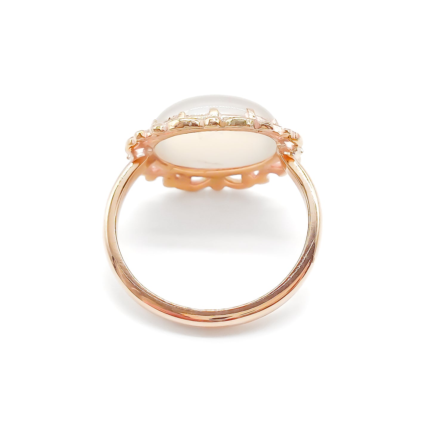 Vintage oval moonstone in a beautiful ornate rose gold ring setting.