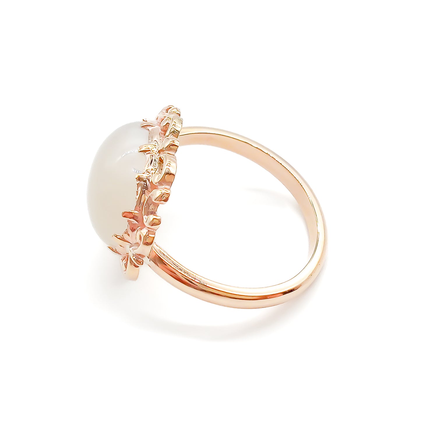 Vintage oval moonstone in a beautiful ornate rose gold ring setting.