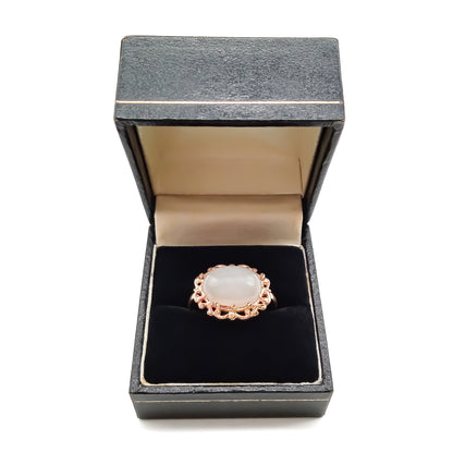 Vintage oval moonstone in a beautiful ornate rose gold ring setting.