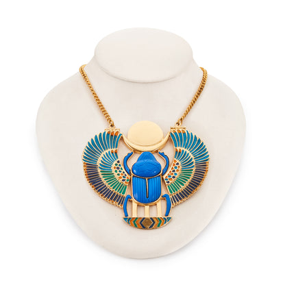 Unusual vintage Egyptian Revival necklace set with a large resin scarab that has colourful enamel detail on the wings. Gold-plated on base metal.
