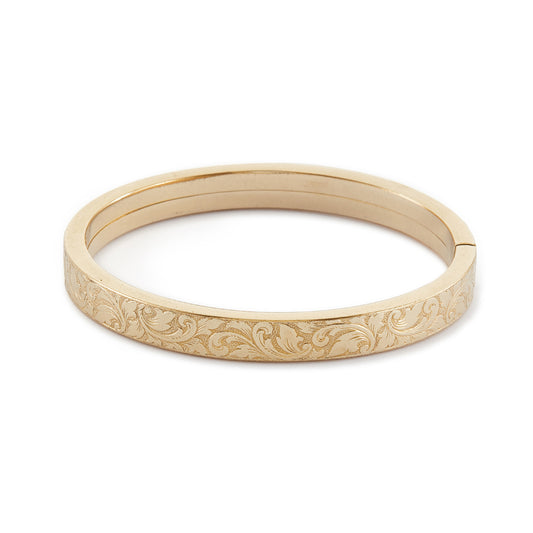 Beautifully engraved hollow gold-plated bangle. Circa 1930s