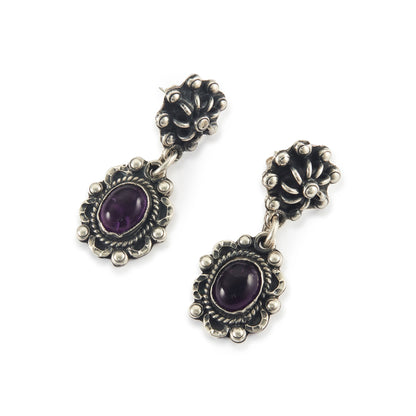 Lovely vintage oxidised sterling silver drop earrings, each set with an oval amethyst cabochon gemstone.
