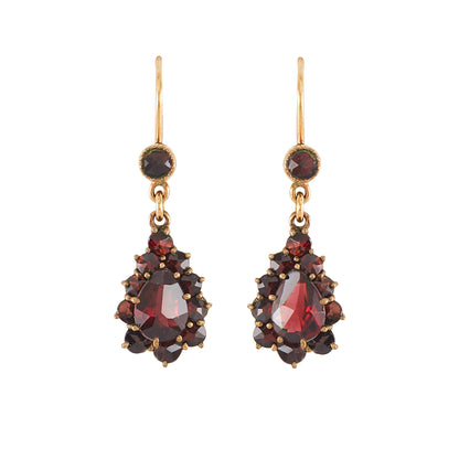 Pretty vintage dangling silver-gilt earrings set with deep red faceted garnets.