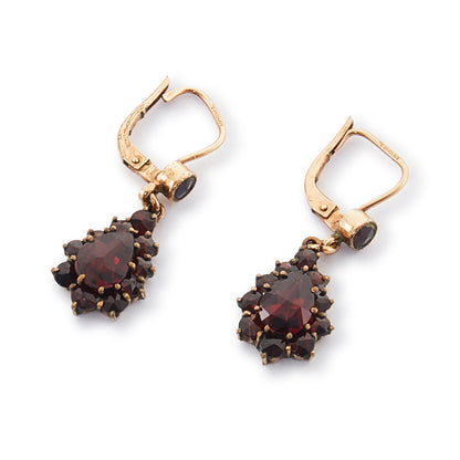 Pretty vintage dangling silver-gilt earrings set with deep red faceted garnets.