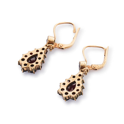 Pretty vintage dangling silver-gilt earrings set with deep red faceted garnets.