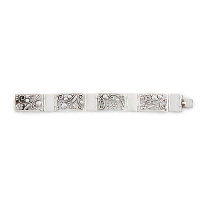 Elegant vintage handmade silver panel bracelet depicting flowers and leaves. German. Stamped AK 835.