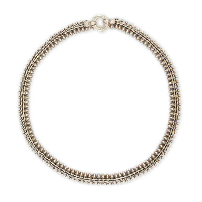 Stylish silver choker necklace with ornate detail and a large bolt ring clasp.