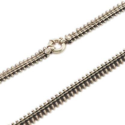 Stylish silver choker necklace with ornate detail and a large bolt ring clasp.