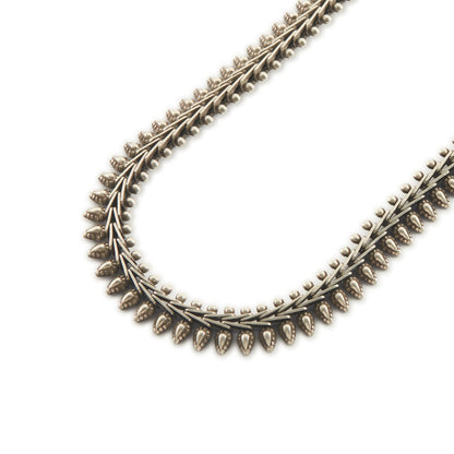 Stylish silver choker necklace with ornate detail and a large bolt ring clasp.