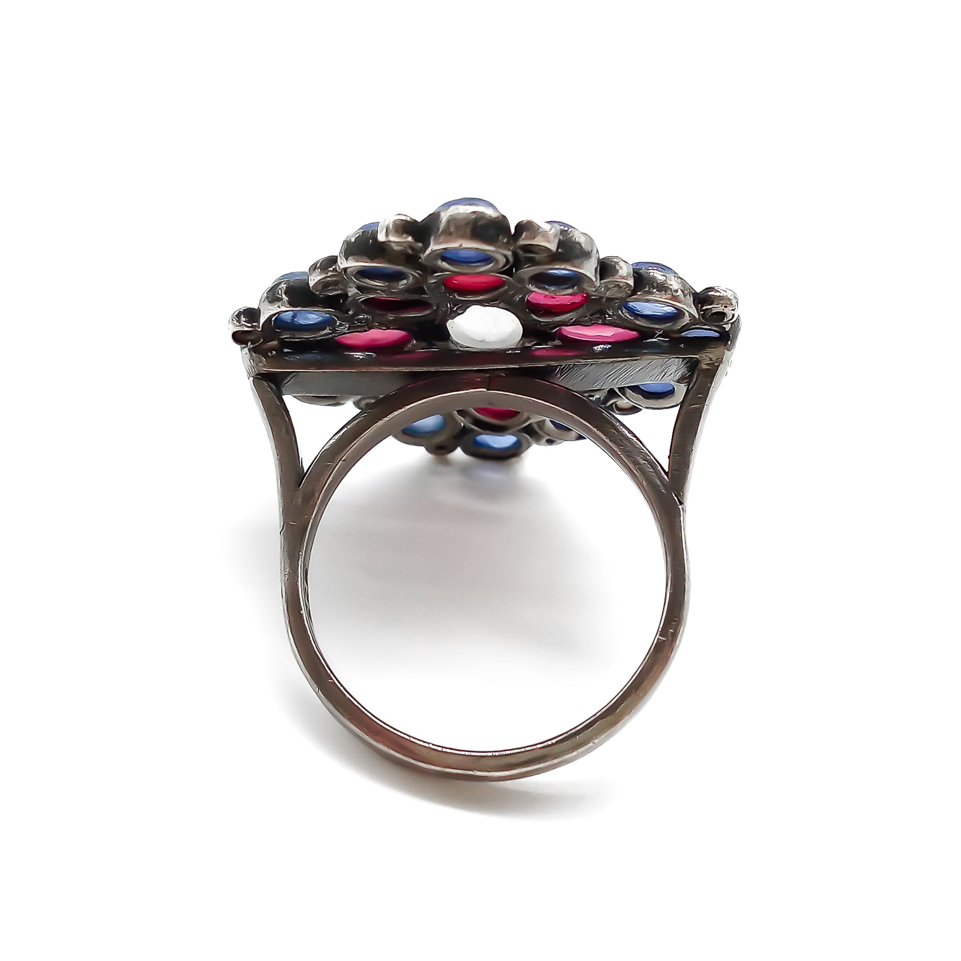 Gorgeous vintage oxidised sterling silver ring set with cabochon sapphires, rubies, a centre moonstone and tiny old-cut diamonds.