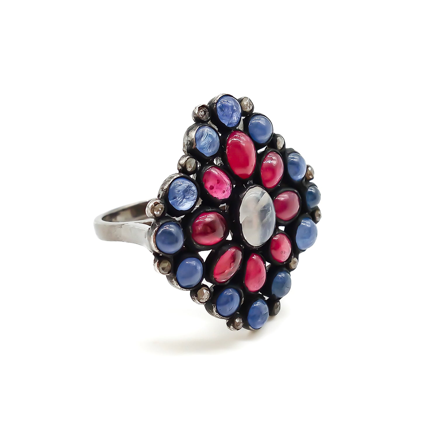 Gorgeous vintage oxidised sterling silver ring set with cabochon sapphires, rubies, a centre moonstone and tiny old-cut diamonds.