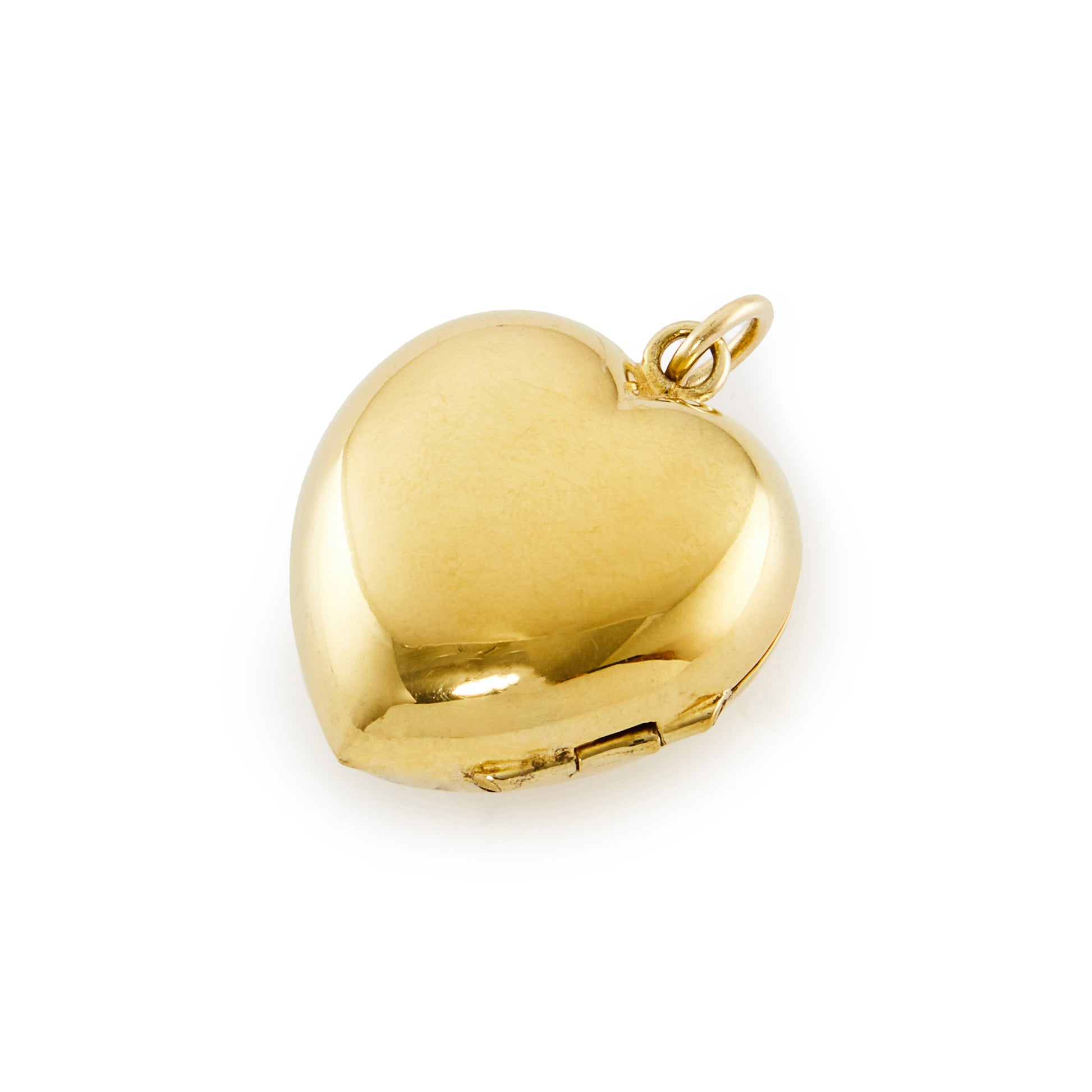 Charming vintage silver gilt puffy heart locket that can take two photographs.