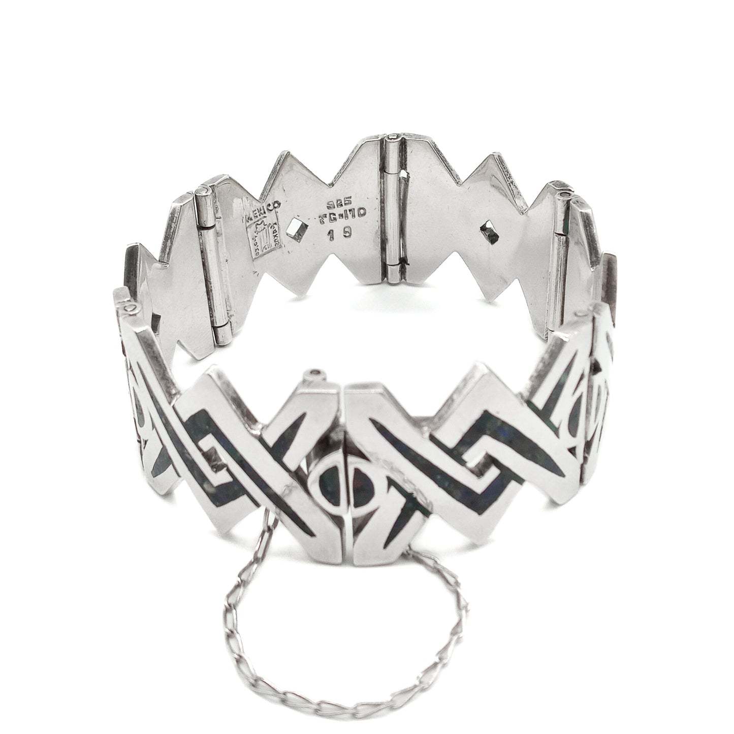 Striking sterling silver mid-century Mexican bracelet with crushed stone inlay work.