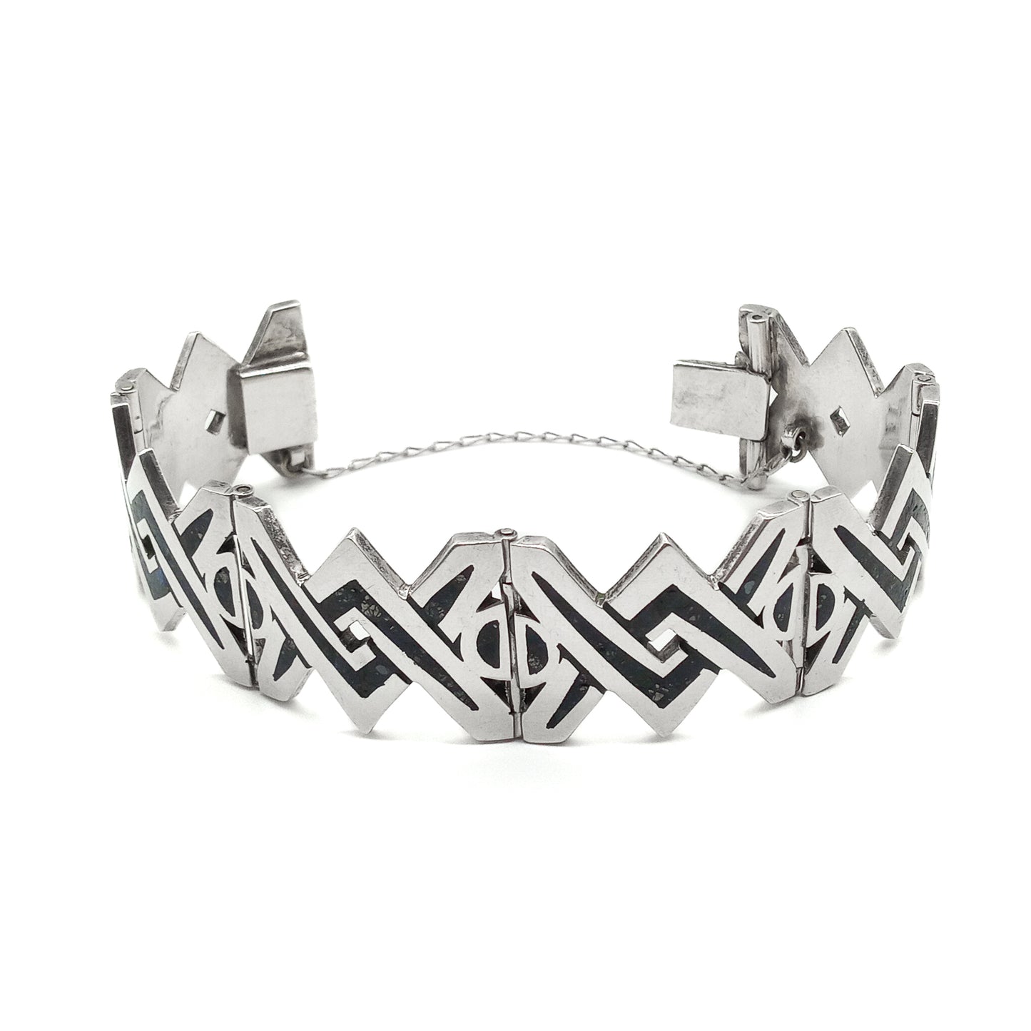 Striking sterling silver mid-century Mexican bracelet with crushed stone inlay work.