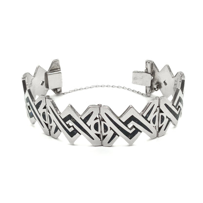 Striking sterling silver mid-century Mexican bracelet with crushed stone inlay work.