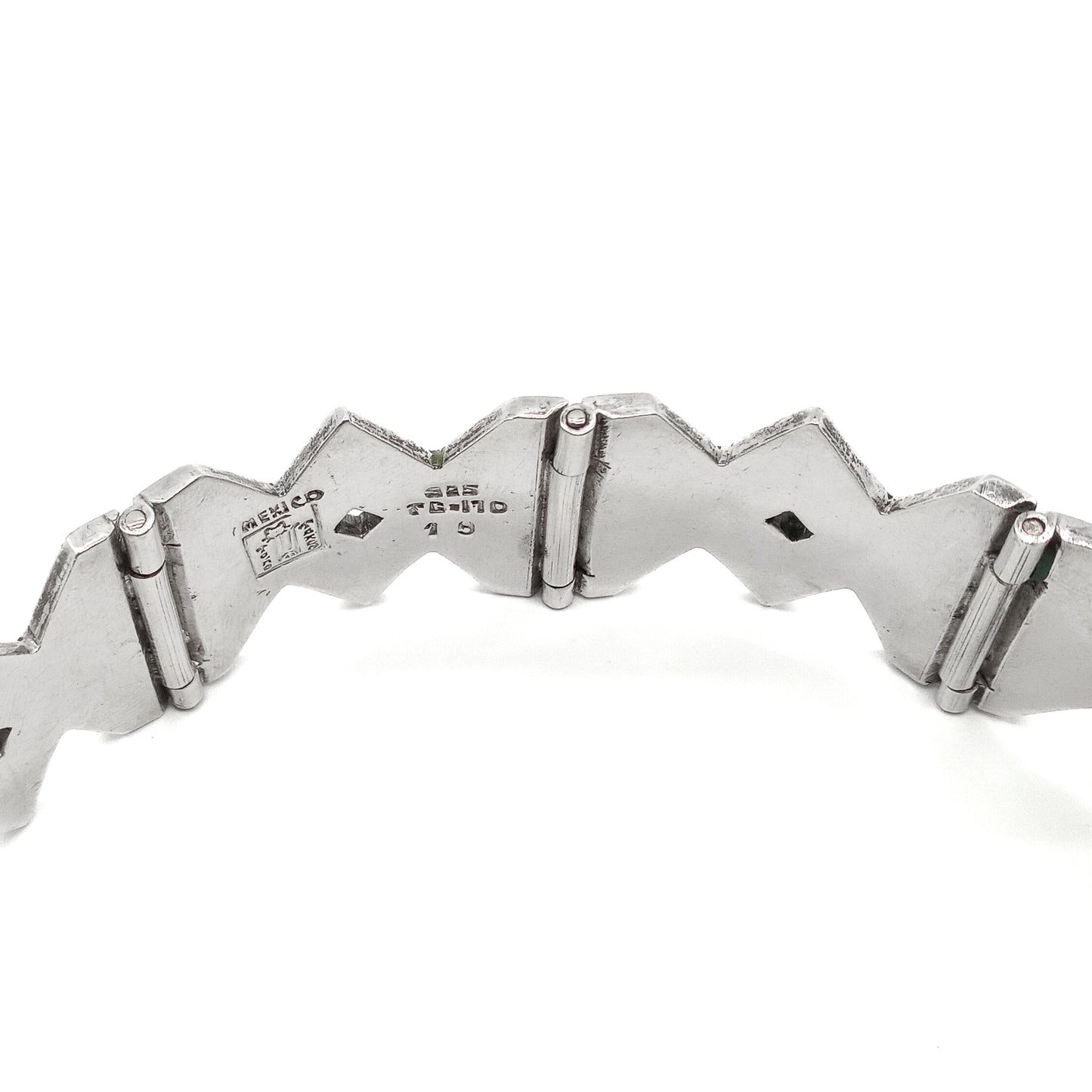 Striking sterling silver mid-century Mexican bracelet with crushed stone inlay work.