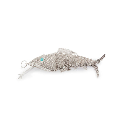 Charming vintage silver filigree spice holder fish pendant with turquoise eyes. The body is articulated with dangling fins.