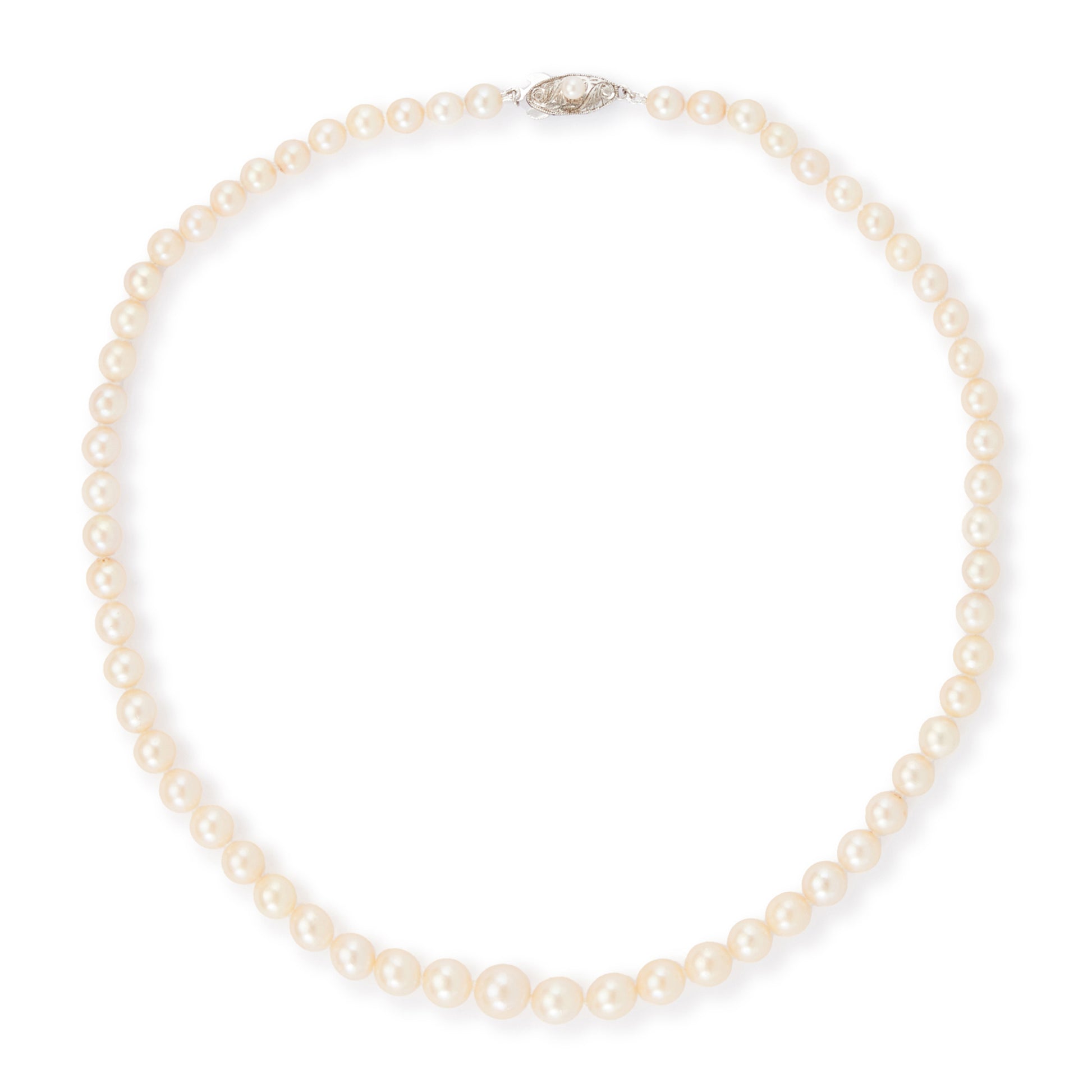 Classic vintage string of graduated seawater pearls with a sterling silver and pearl clasp. The pearls have a creamy hue and a good lustre.
