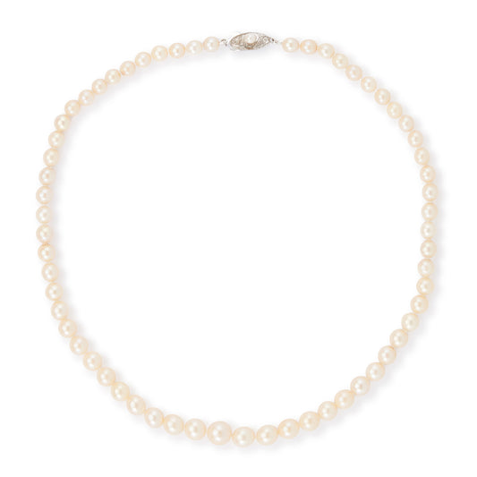Classic vintage string of graduated seawater pearls with a sterling silver and pearl clasp. The pearls have a creamy hue and a good lustre.