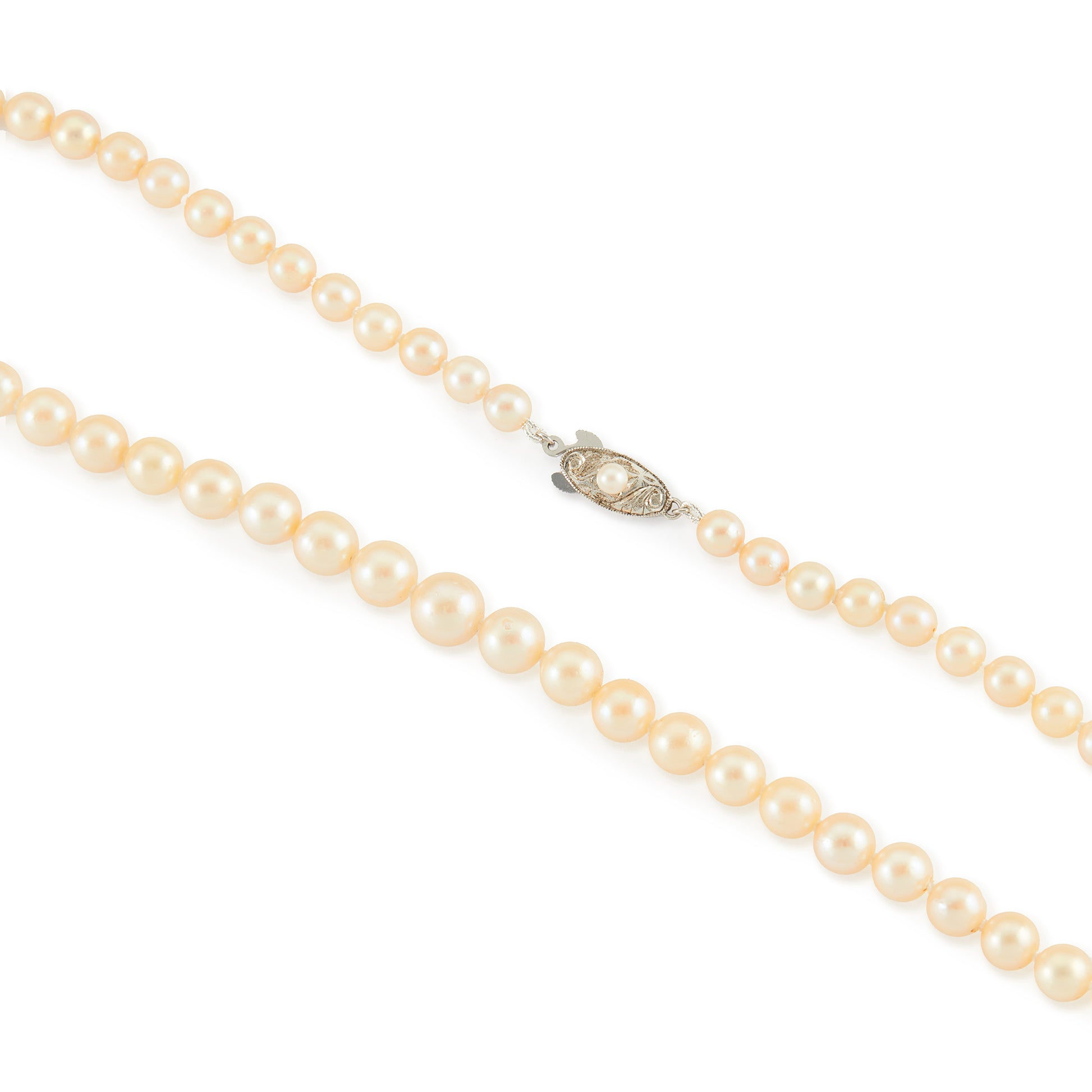 Classic vintage string of graduated seawater pearls with a sterling silver and pearl clasp. The pearls have a creamy hue and a good lustre.